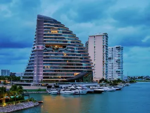Quintana Prints: Shark Tower at dusk, Puerto Cancun, Cancun, Quintana Roo State, Mexico