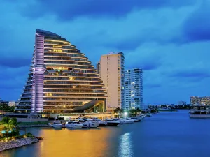 Quintana Prints: Shark Tower at dusk, Puerto Cancun, Cancun, Quintana Roo State, Mexico