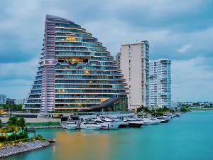 Quintana Prints: Shark Tower at dusk, Puerto Cancun, Cancun, Quintana Roo State, Mexico
