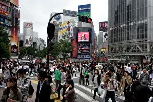 Street Scenes Prints: Shibuya crossing in front of the Shibuya train station is one of Tokyos busiest city centers