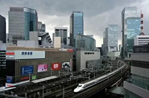 Images Dated 14th May 2009: Shinkansen bullet train weaving through maze of buildings in the Yurakucho district of downtown