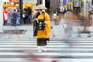 Images Dated 11th December 2010: Shinto monk in traditional dress collecting alms (donations), Ginza, Tokyo, Honshu, Japan, Asia