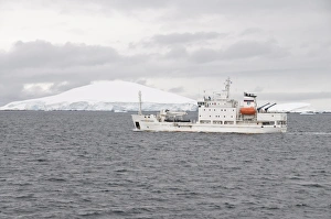 Ship sailing in the waters around the Antarctic Peninsula, Antarctica, Polar Regions Ship sailing in the waters around the Antarctic Peninsula, Antarctica, Polar Regions