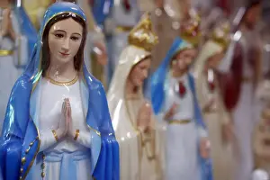 Religious Icon Prints: Shop selling religious Christian items including Holy Virgin statues, Ho Chi Minh City