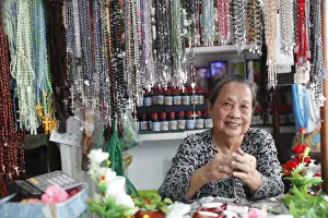Shop selling religious Christian items including Rosary prayer beads, Ho Chi Minh City