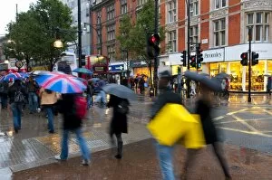 Images Dated 1st October 2010: Shoppers in the rain, Oxford Street, London, England, United Kingdom, Europe