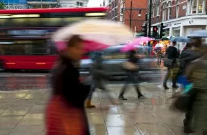 Images Dated 1st October 2010: Shoppers in the rain, Oxford Street, London, England, United Kingdom, Europe