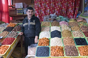 Alma Ata Prints: Shopseller in the bazaar selling dried fruits, Almaty, Kazakhstan, Central Asia, Asia