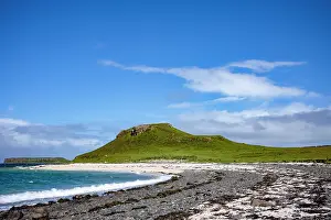 Refreshing Prints: Shoreline at Coral beach features a grassy hill and blue sky on the Isle of Skye in Scotland