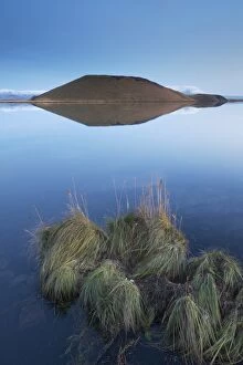 Shores of Lake Myvatn at dusk, fine pseudo-crater in the distance, near Skutustadir