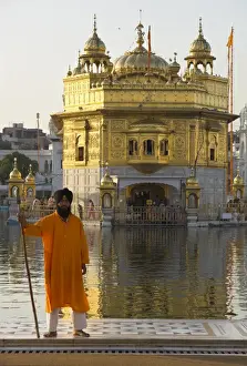 Guard Prints: Shrine guard in orange clothes holding lance standing