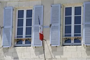 Shuttered windows and French flag, La Flotte, Ile de Re, Charente-Maritime