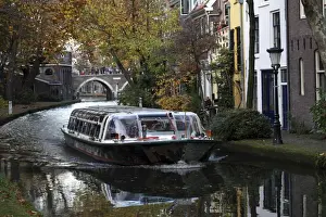 Barge Prints: A sightseeing barge tours along the Oudegracht Canal in the Dutch city of Utrecht