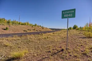 Trail Prints: Sign marking the highest point on Kaibab Plateau at 8840 feet elevation in northern Arizona