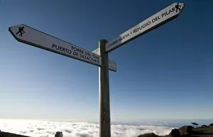 Signpost for trekkers above the clouds on top of the Taburiente, Canary Islands