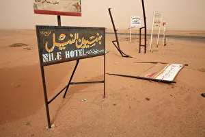 Sudan Prints: Signposts stand in the desert along the Khartoum to Atbara highway