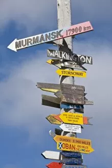Images Dated 3rd March 2009: Signs with mileage to world destinations made into a totem pole, Port Stanley