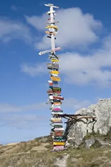 Images Dated 3rd March 2009: Signs with mileage to world destinations made into a totem pole, Port Stanley