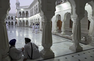 Amritsar Prints: Two Sikhs priests at dawn sitting under arcades