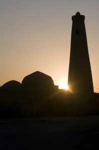 Khiva Prints: Silhouette of Minaret in the setting sun, Khiva, Uzbekistan, Central Asia