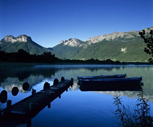 Lake Annecy Prints: Silhouette of pier and rowing boats, Lake Annecy, Rhone Alpes, France, Europe