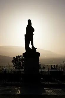 Silhouettes Prints: Silhouette of statue of Robert the Bruce at sunrise
