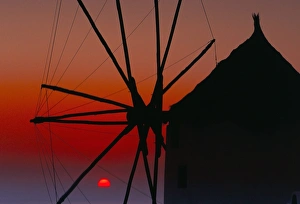 Silhouette of windmill at sunset