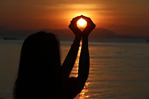 25 29 Prints: Silhouette of a woman standing by the sea at sunset, Kep, Cambodia, Indochina