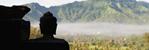 Traditionally Indonesian Prints: Silhouetted Buddha at Borobudur Temple at sunrise
