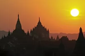 Silhouettes of the temples and pagodas of the ruined town of Bagan at sunset