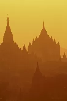 Images Dated 28th December 2007: Silhouettes of the temples of the ruined city of Bagan at sunrise, Myanmar, Asia