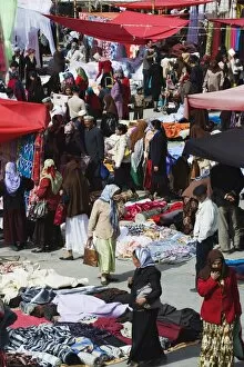 Silk fabrics being sold at the Sunday market, Kashgar (Kashi) city, Xinjiang Provice