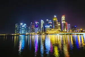 Singapore skyline from Marina Bay at night with the Fullerton Hotel and Jubilee Bridge