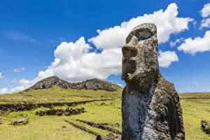 Restored Prints: Single moai statue guards the entrance at the 15 moai restored ceremonial site of Ahu Tongariki on Easter Island