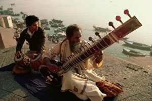 Indian Culture Gallery: Sitar and tabla player beside the Ganga River, Varanasi, Uttar Pradesh state, India, Asia