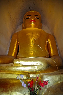 Sitting Buddha in a temple in the ruined city of Bagan, Myanmar, Asia