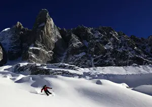 Helmet Prints: A skier enjoying perfect powder snow on the celebrated Pas de Chevre off-piste run
