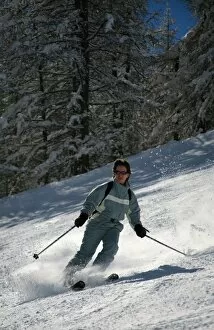 A skier enjoys spring snow on the piste in the small resort of Pelvoux