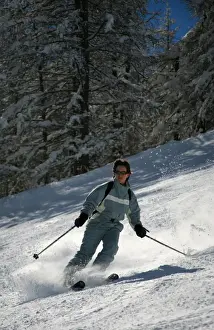 Skiers Prints: A skier enjoys spring snow on the piste in the small resort of Pelvoux