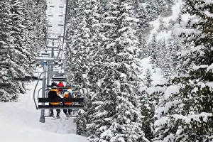Leisure Activity Prints: Skiers on a chairlift, Meribel ski resort in the Three Valleys (Les Trois Vallees)