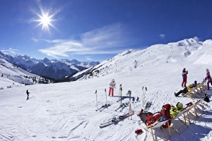 Deckchair Prints: Skiers relaxing at cafe in winter sunshine