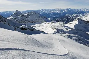 Alps Prints: Skiers skiing on a ski run, mountain scenery in Cervinia ski resort, Cervinia