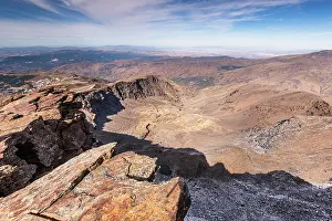 Granada Prints: Sky view from Pico de la Veleta with jagged rocks and barren ridges in Sierra Nevada of Andalusia