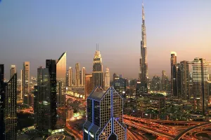 Attractions Prints: Skyline of central Dubai at night featuring Burj Khalifa against a twilight backdrop
