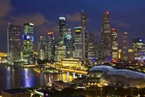 Images Dated 2nd July 2009: Skyline of Financial district illuminated at dusk, Singapore, Southeast Asia, Asia