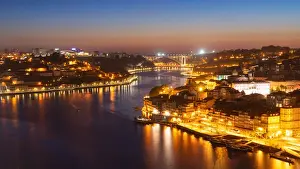Porto Prints: Skyline of the historic city of Porto at night with the bridge Ponte de Arrabida in the background