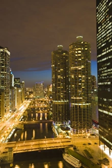 Skyscrapers lining the Chicago River and West Wacker Drive at dusk, Marina City on the right Skyscrapers lining the Chicago River and West Wacker Drive at dusk, Marina City on the right