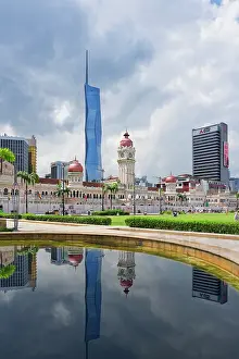 Skyscrapers Prints: Skyscrapers reflecting in Merdeka square pond, Kuala Lumpur, Malaysia, Asia
