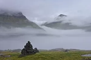Slaettaratindur peak, highest point in Faroes at 882m, emerging from the mist