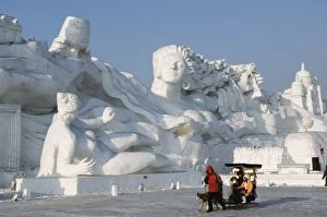 A sled ride at the Snow and Ice Sculpture Festival at Sun Island Park, Harbin